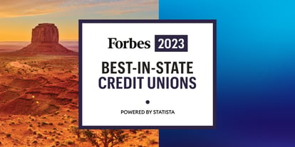 A breathtaking sunset over the Arizona desert mountains, featuring the prestigious 'Forbes 2022 Best-in-State Credit Unions, Powered by Statista' black and white graphic off to the left-hand side within the scenic landscape.