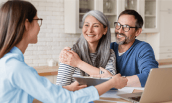 A husband and wife talking to a Wills and Trust advisor