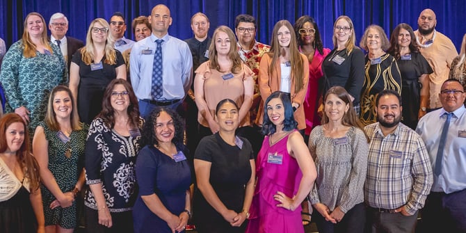 Jeff Meshey standing with 30 of the former Adult Learner scholarship recipients. 