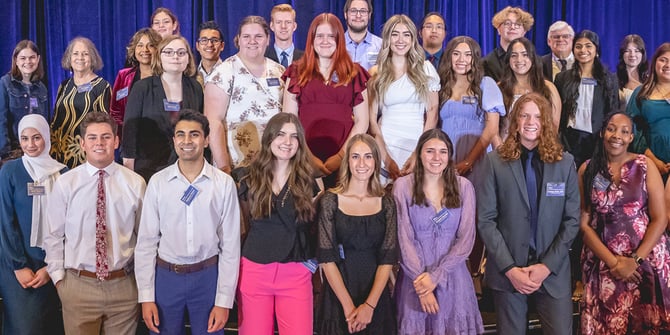 Jeff Meshey proudly stands alongside a group of 30 senior high school students who have been honored with the Community Service Scholarship.