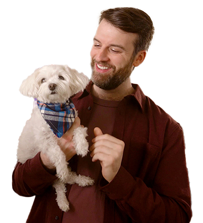 A man holding a dog