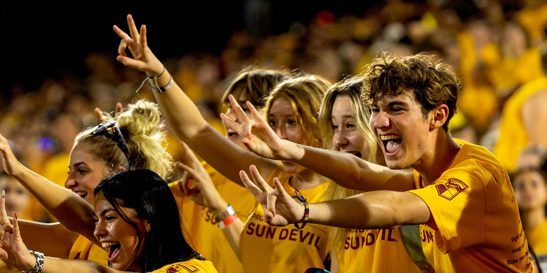 ASU fans at a game, cheering on the Sun Devils